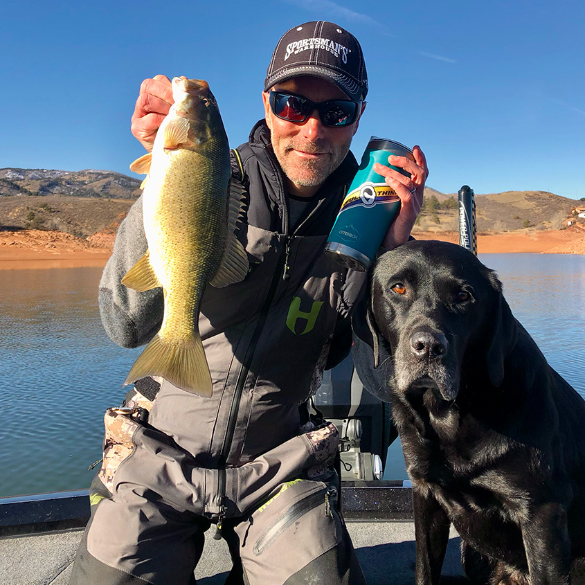 Chad LaChance and his dog Ranger on the boat
